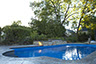 Blue Crystal Clear Swimming Pool with Rock Waterfall, Beautiful Backyard built by Flandscape in London Ontario