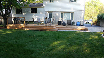 Outdoor bathroom with toilet sink and dresser all white and black