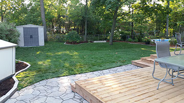 Outdoor bathroom with toilet sink and dresser all white and black