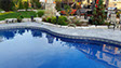 Blue Crystal Clear Swimming Pool with Rock Waterfall, Beautiful Backyard built by Flandscape in London Ontario