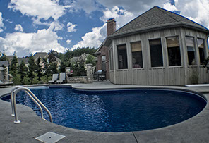 Blue Crystal Clear Swimming Pool with Rock Waterfall, Beautiful Backyard
