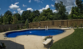 Blue Crystal Clear Swimming Pool with Rock Waterfall, Beautiful Backyard