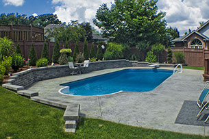 Blue Crystal Clear Swimming Pool with Rock Waterfall, Beautiful Backyard