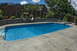 Blue Crystal Clear Swimming Pool with Rock Waterfall, Beautiful Backyard