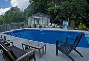 Blue Crystal Clear Swimming Pool with Rock Waterfall, Beautiful Backyard