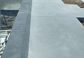 Outdoor bathroom with toilet sink and dresser all white and black