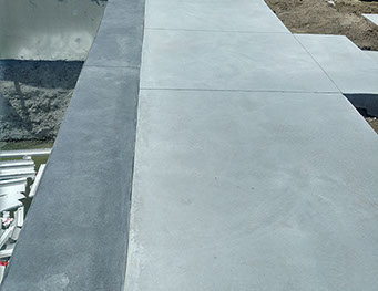 Outdoor bathroom with toilet sink and dresser all white and black