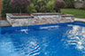 Blue Crystal Clear Swimming Pool with Rock Waterfall, Beautiful Backyard built by Flandscape in London Ontario