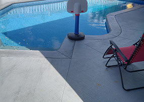 Blue Crystal Clear Swimming Pool with Rock Waterfall, Beautiful Backyard