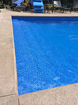 Blue Crystal Clear Swimming Pool with Rock Waterfall, Beautiful Backyard